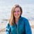 Christine Rolin HIE's Green Offshore Technology and Blue Economy manager sitting on a beach