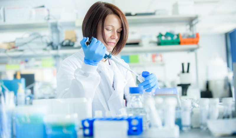Scientist working in a lab at the centre for health science, Inverness