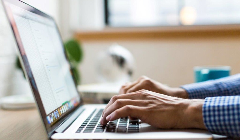 Person typing on laptop