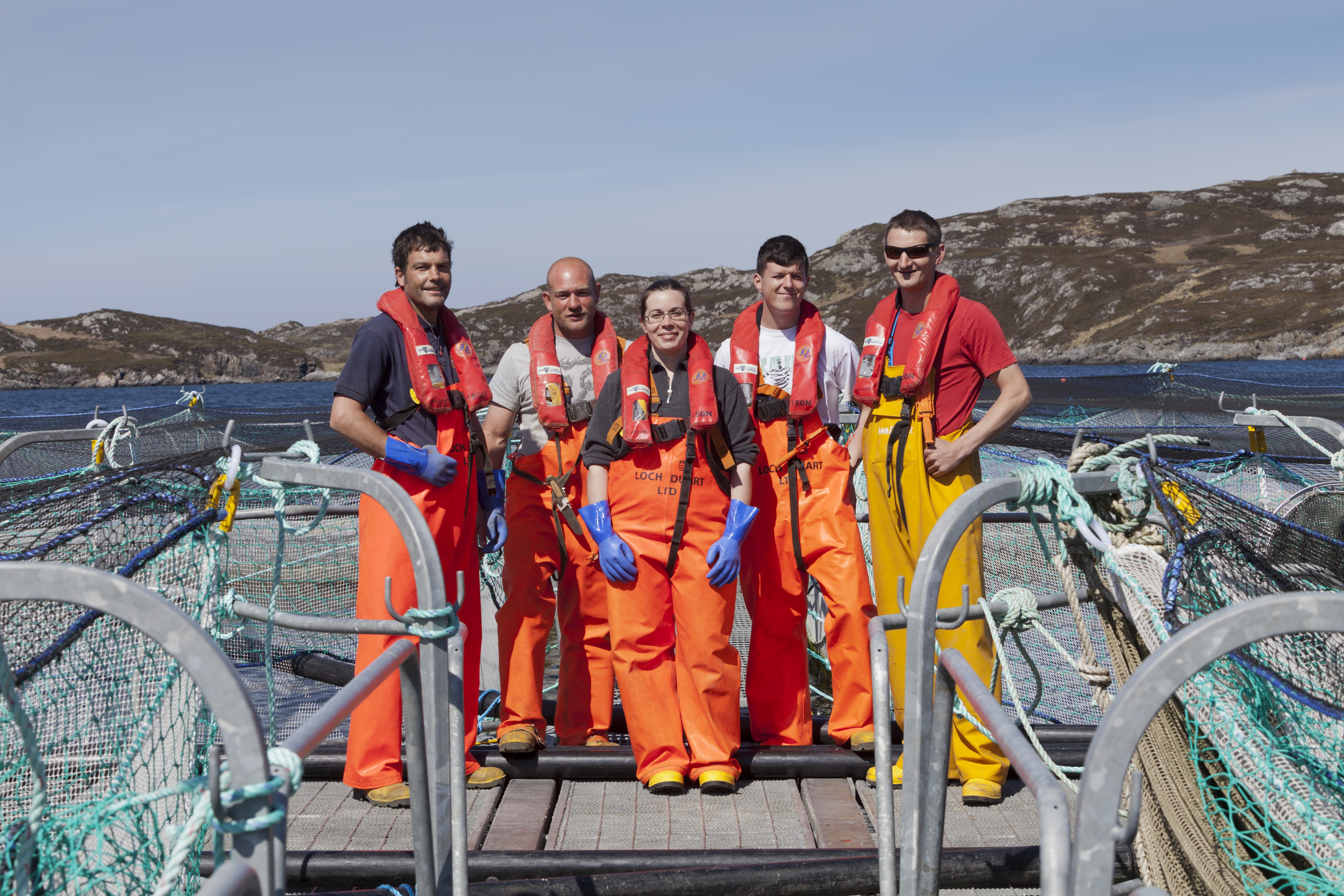 Group of fishermen tending nets