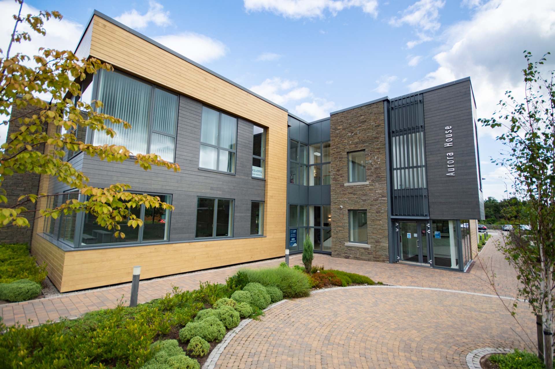 Outside of Aurora house building on Inverness Campus