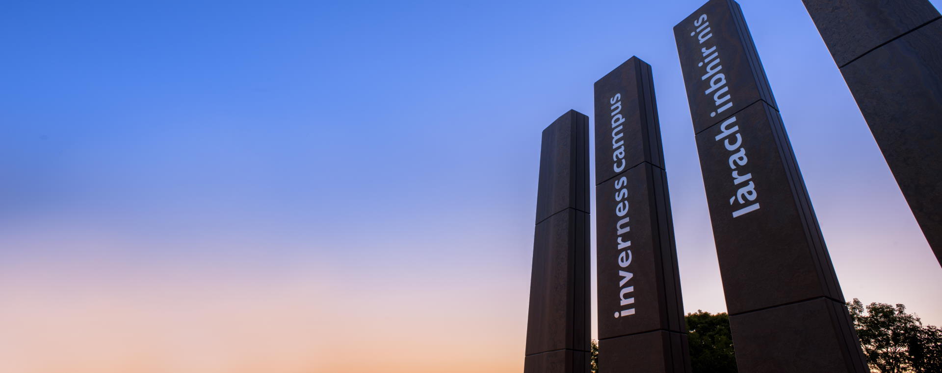 Sun setting above the entrance to Inverness Campus 