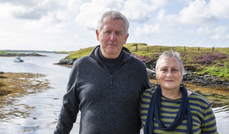 man and woman standing by the sea