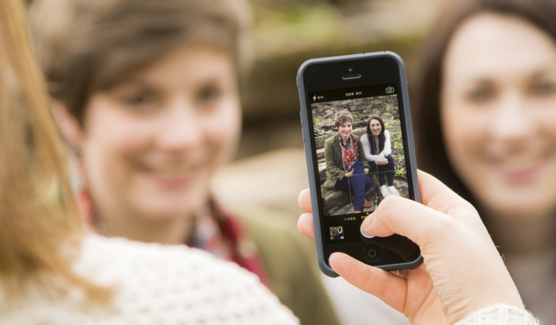 Person taking photo with mobile phone