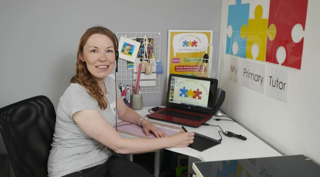 Karen Simpson of My Primary tutor sitting in front of computer